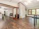 Spacious bonus room with hardwood floors, brick accents, and ample natural light at 9300 Surrey Rd, Mint Hill, NC 28227