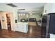 Open-concept kitchen flowing into a cozy living area with fireplace and modern furnishings at 9300 Surrey Rd, Mint Hill, NC 28227