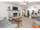 Open concept living room with fireplace, hardwood flooring and access to the kitchen at 9300 Surrey Rd, Mint Hill, NC 28227