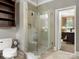 Modern bathroom features a glass shower and convenient built-in shelving at 1010 Arabian Farm Rd, Clover, SC 29710