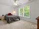 Bright bedroom with a ceiling fan, large windows, and neutral carpet at 1010 Arabian Farm Rd, Clover, SC 29710