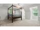 Cozy bedroom with a four-poster bed, natural light, and vaulted ceilings at 1010 Arabian Farm Rd, Clover, SC 29710