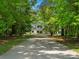 Inviting driveway leading to a charming two-story home with classic architectural details at 1010 Arabian Farm Rd, Clover, SC 29710