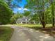 Stately two-story home on expansive lot with mature trees and winding driveway at 1010 Arabian Farm Rd, Clover, SC 29710