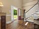 Open foyer with hardwood floors, staircase, and view to the front lawn at 1010 Arabian Farm Rd, Clover, SC 29710