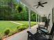 Inviting front porch with ferns, ceiling fans, and ample space for relaxation at 1010 Arabian Farm Rd, Clover, SC 29710