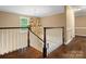 Elegant hallway with hardwood floors, chandelier, and staircase leading upstairs at 1010 Arabian Farm Rd, Clover, SC 29710