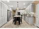 Bright kitchen featuring white cabinets, stainless steel appliances, a kitchen island and tile flooring at 1010 Arabian Farm Rd, Clover, SC 29710