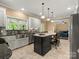 Modern kitchen with stainless steel appliances, center island with seating, and bright lighting at 1010 Arabian Farm Rd, Clover, SC 29710