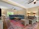 Inviting living room featuring a cozy sectional, patterned rug, and a warm, neutral color palette at 1010 Arabian Farm Rd, Clover, SC 29710
