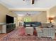 Comfortable living room with hardwood floors, large sectional, and modern entertainment center at 1010 Arabian Farm Rd, Clover, SC 29710