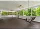 Relax on this screened-in porch with porch swing and ceiling fans at 1010 Arabian Farm Rd, Clover, SC 29710