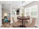 Cozy dining area with natural light, stylish furnishings, and a view into the living room at 10945 Wiltshire Ln, Charlotte, NC 28262