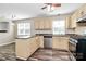 Open kitchen with light wood cabinets, modern appliances, and spacious island for meal prep at 10945 Wiltshire Ln, Charlotte, NC 28262