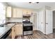 Functional kitchen featuring an oven, sink, and generous cabinetry and counter space at 10945 Wiltshire Ln, Charlotte, NC 28262