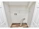 Functional laundry room with shelving, providing ample storage and convenience at 10945 Wiltshire Ln, Charlotte, NC 28262
