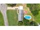 Aerial view of home featuring an inground pool, patio deck, carport, and verdant lawn at 1104 Colony Ct, Gastonia, NC 28056