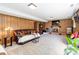 Cozy finished basement boasts a brick fireplace, wood paneling, and plush carpeting at 1104 Colony Ct, Gastonia, NC 28056