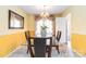 Elegant dining room featuring a glass table and decorative accents at 1104 Colony Ct, Gastonia, NC 28056