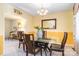 Formal dining room with a modern glass table, chandelier, and elegant decor at 1104 Colony Ct, Gastonia, NC 28056