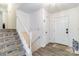 Welcoming entryway with stairway, front door, and durable flooring at 1104 Colony Ct, Gastonia, NC 28056