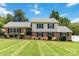 Beautifully landscaped home with a lush green lawn and manicured shrubs adding to its curb appeal at 1104 Colony Ct, Gastonia, NC 28056