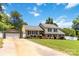 Charming two-story home featuring a well-manicured lawn, a carport, and inviting curb appeal at 1104 Colony Ct, Gastonia, NC 28056