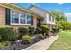 Charming brick home with a landscaped yard, black shutters, and a welcoming entrance, creating curb appeal at 1104 Colony Ct, Gastonia, NC 28056