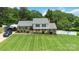 Charming home exterior with a lush green lawn and manicured landscaping at 1104 Colony Ct, Gastonia, NC 28056