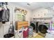 Functional laundry room equipped with modern washer and dryer, ample storage, and natural light at 1104 Colony Ct, Gastonia, NC 28056