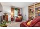 Comfortable living room with armchairs, bookcase, and carpet at 1104 Colony Ct, Gastonia, NC 28056