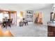 Spacious living room with seamless flow into the dining area with views of the staircase at 1104 Colony Ct, Gastonia, NC 28056