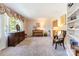 Cozy living room with a piano, classic furnishings, and a built-in bookshelf at 1104 Colony Ct, Gastonia, NC 28056