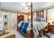 Comfortable main bedroom with canopy bed, dresser, and neutral tones at 1104 Colony Ct, Gastonia, NC 28056