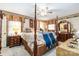 Spacious main bedroom with canopy bed, ceiling fan, and patterned decor at 1104 Colony Ct, Gastonia, NC 28056