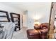 Bright office space with bookshelf and comfortable seating area at 1104 Colony Ct, Gastonia, NC 28056