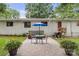 Charming patio area with outdoor seating, a grill, and views of the well-maintained backyard at 1109 S Highland Ave, Landis, NC 28088