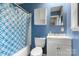 Cozy full bathroom featuring a shower-tub combo and a vanity with storage at 1109 S Highland Ave, Landis, NC 28088