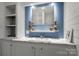 Charming bathroom with white cabinets, marble countertop, framed mirror, and seaside decor at 1109 S Highland Ave, Landis, NC 28088