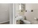 Cozy bathroom features a white sink and toilet with neutral tiling and a built-in shelf at 1109 S Highland Ave, Landis, NC 28088