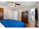 Bedroom featuring hardwood floors, a closet, and an ensuite bathroom for added privacy at 1109 S Highland Ave, Landis, NC 28088