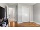 Bright bedroom with hardwood floors, neutral walls, closet, and a view to the bathroom at 1109 S Highland Ave, Landis, NC 28088