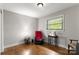 Comfortable bedroom with hardwood floors, a large window, and neutral wall color at 1109 S Highland Ave, Landis, NC 28088