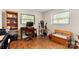 Home office featuring a wood desk, wood floors, and natural light from two windows at 1109 S Highland Ave, Landis, NC 28088