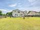 Spacious backyard with patio furniture offers a relaxing outdoor space, perfect for enjoying sunny days at 1109 Woodwinds Dr, Waxhaw, NC 28173