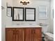 Bathroom featuring double sinks and decorative mirrors at 1109 Woodwinds Dr, Waxhaw, NC 28173