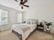 Bedroom featuring large windows and a bed with pillows at 1109 Woodwinds Dr, Waxhaw, NC 28173