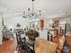 Open-concept room featuring a dining area adjacent to the living room and kitchen at 1109 Woodwinds Dr, Waxhaw, NC 28173