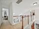 Upstairs hallway with white railings and natural light from skylights at 1109 Woodwinds Dr, Waxhaw, NC 28173