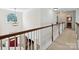 Open hallway with a view of the foyer featuring a red front door and an arched window at 1109 Woodwinds Dr, Waxhaw, NC 28173